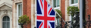 The British flag symbolizes the post-market surveillance (PMS) requirements for medical devices in the United Kingdom.