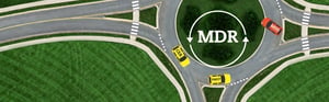 MDR-Kreisverkehr mit CER-, PMCF- und MDD-Elementen zur Veranschaulichung der Anforderungen der EU-Medizinprodukteverordnung und des MDR-Übergangsprozesses.